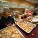 From left Emily Sanders, Charlotte Sanders and Alansra Meade volunteer their time to serve up a traditional Thanksgiving meal at the Vineyard Church on Thanksgiving day.
Courtney Sacco I AnnArbor.com 